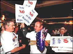 Supporters of the NO vote hand out flags and placards at a rally in Sydney 