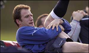 Mike Catt warms up during training