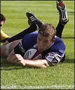 Dan Lyle slides in to score a try for Bath