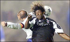 Fulham's Rufus Brevett jumps with Hertha Berlin's Stefan Beinlich