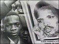 Steve Biko supporter with poster of black consciousness leader