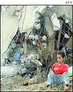 A child outside a destroyed house in Jenin