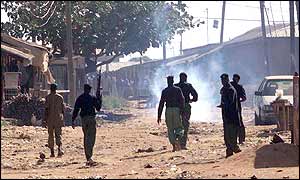 Policeman disperse rioters in Kaduna, Nigeria 
