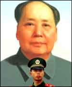 Chinese soldier and Mao portrait