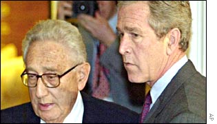 President Bush meets Henry Kissinger in the White House