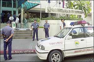 Police guard the Australian Embassy in Manila