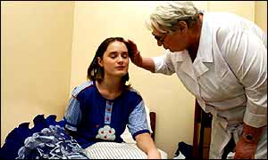 Doctor examines child