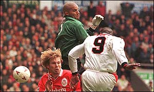 Andy Cole heads home Manchester United's third goal after David James flaps at a cross