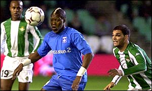Auxerre's Djildril Cisse shields the ball from Assuncaa and Rivas