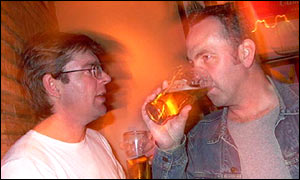 Men drinking beer in a pub