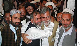 Akram Khan Durrani (second from right) is greeted by other legislators in NWFP state assembly