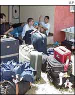 Israeli tourists wait at the hotel after the blast