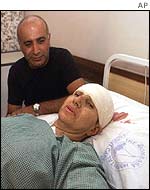 Israeli tourist is comforted by her husband in Kenyan hospital 