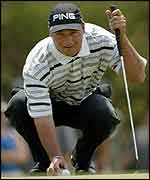 Chris DiMarco surveys a putt on the Sun City course