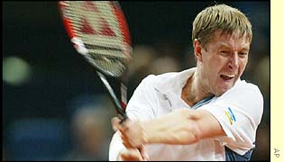 Russia's Yevgeny Kafelnikov hits a forehand