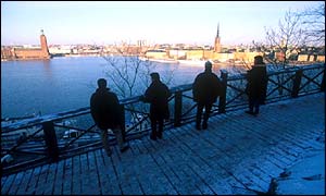 People look out over the Stockholm skyline
