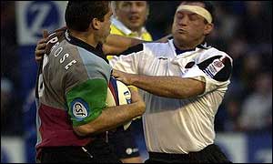 Quins No 8 Tony Diprose tangles with Richard Hill