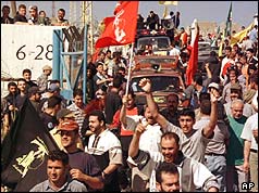 Villagers joyfully return to their village of Houla on 22 May 2000, after the Israeli withdrawal