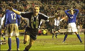 Newcastle's Craig Bellamy celebrates scoring the winner against Everton