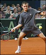 Mikhail Youzhny hits a forehand against Paul-Henri Mathieu