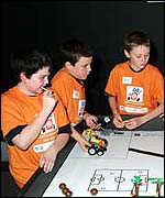 Boys showing off robot skills