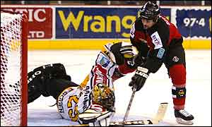 Sean Selmser scores the Giants second goal against Eric Raymond of Rouen in the semi-finals