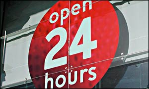24-hour opening sign on a shop