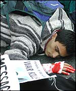 Protesters lying down in the road at Whitehall.