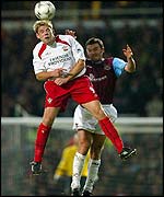 Southampton's James Beattie outjumps West Ham's Christian Dailly
