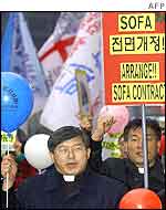 South Korean protesters march towards the US embassy in Seoul on Tuesday
