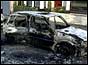 Charred remains of cars after the riots