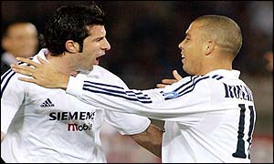 Ronaldo celebrates the opening goal with Luis Figo