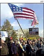 Anti-US demonstrators burn a US flag in Tehran