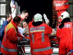 Rescue workers evacuating injured from the building