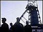 Silhouette of miners against pithead at Mid Glamorgan