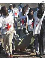 Rescue workers recover a body