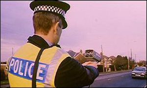 Policeman with mobile speed camera