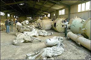 Journalists work at the al-Muthanna military complex 