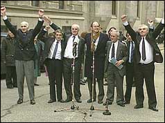 Birmingham Six group round microphone outside Old Bailey