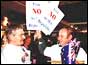 Supporters of the NO vote hand out flags and placards at a rally in Sydney 