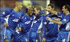 Nathan Ellington of Wigan celebrates scoring in the 28th minute with his team-mates 