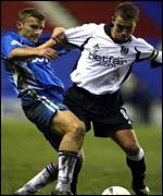 Wigan's Neil Roberts (left) and Fulham's Lee Clark