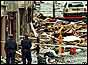 Police survey the devastation caused by the Omagh bomb in August 1998 (AP)