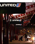 A lone passenger arrives for a flight at Chicago O'Hare International Airport on Wednesday. 