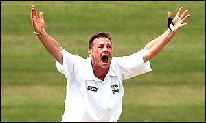 Andrew Schwass celebrates one of his three wickets