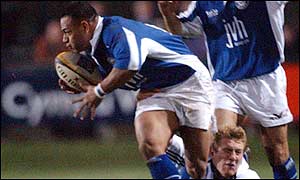 Bridgend's Aisea Havili beats Mike Tindall's tackle