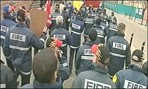 Striking firefighters march
