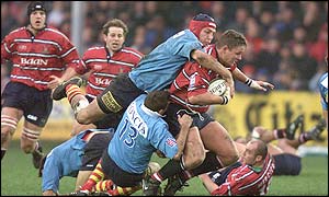 Gloucester's Ed Pearce is stopped in his tracks