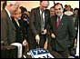 Donald Dewar cuts a cake to celebrate the 'Yes' vote for political referendum