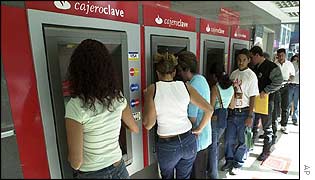 Venezuelans queue at cash machines in Caracas